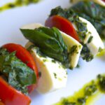 Fresh Caprese Skewers Drizzled with Zesty Basil Pesto