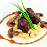 Savor Seared Venison Medallions with Rich Mushroom Sauce