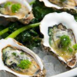 Oysters Rockefeller: The Luxurious Tale Behind the Classic Dish